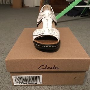 Clark’s white sandals
